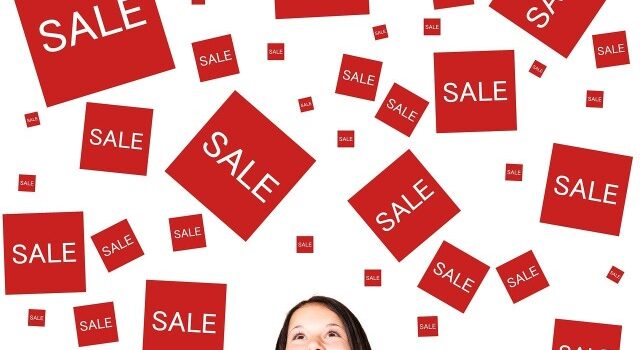 girl and sale signs